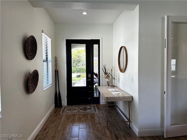 entrance foyer featuring baseboards, wood finished floors, and recessed lighting