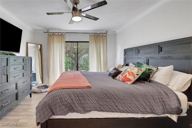 bedroom featuring light hardwood / wood-style flooring, ornamental molding, and ceiling fan