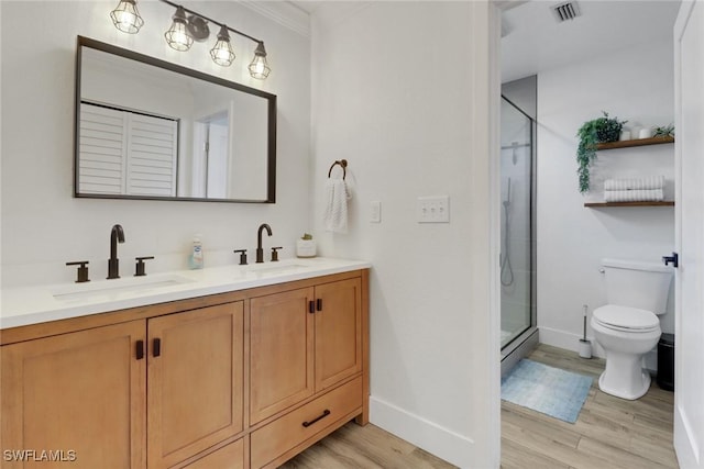 bathroom with walk in shower, vanity, toilet, and hardwood / wood-style flooring