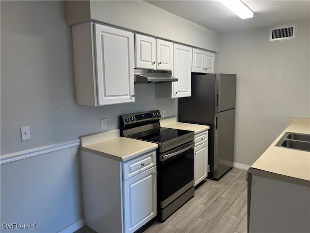 kitchen with white cabinetry, sink, and appliances with stainless steel finishes