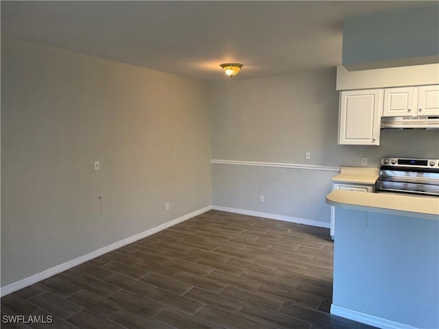 kitchen featuring dark wood-type flooring, white cabinets, and stainless steel range with electric stovetop