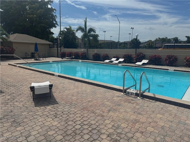 view of swimming pool with a patio area