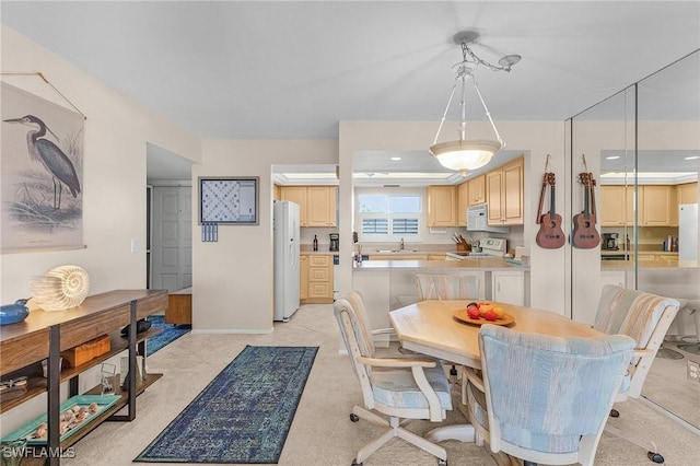 dining space featuring sink