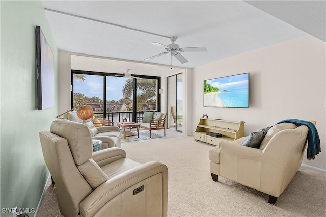 carpeted living room featuring ceiling fan