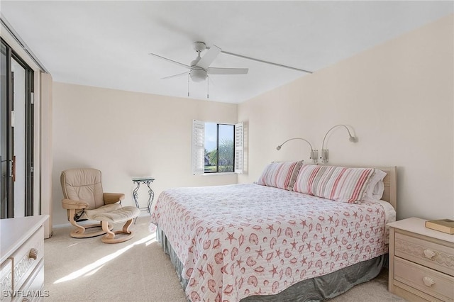 bedroom with ceiling fan and light colored carpet