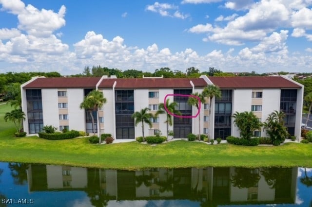 view of building exterior featuring a water view