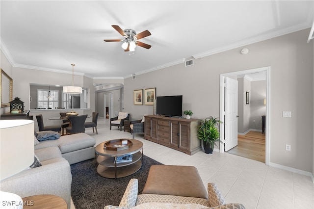 tiled living room featuring crown molding and ceiling fan