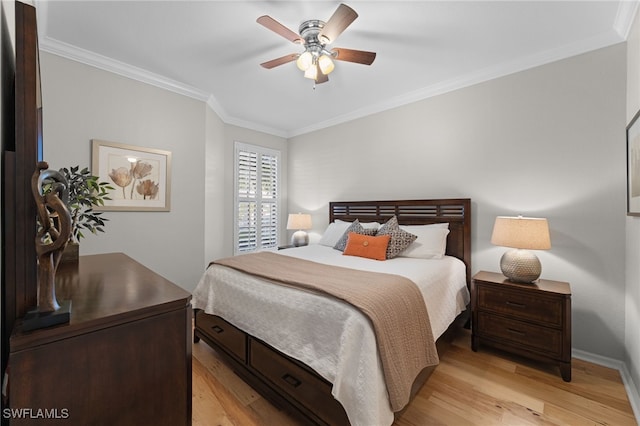 bedroom featuring crown molding, ceiling fan, and light hardwood / wood-style flooring