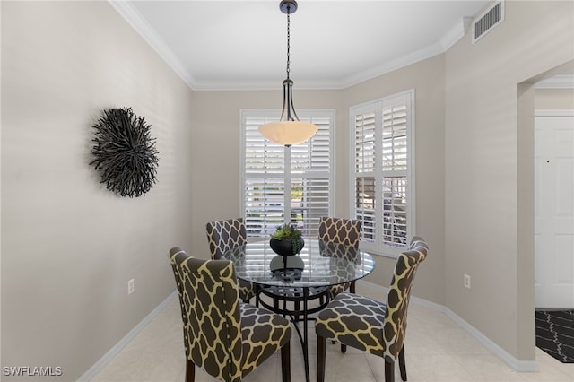 tiled dining space with crown molding