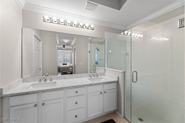 bathroom with ceiling fan, tile patterned flooring, an enclosed shower, vanity, and ornamental molding