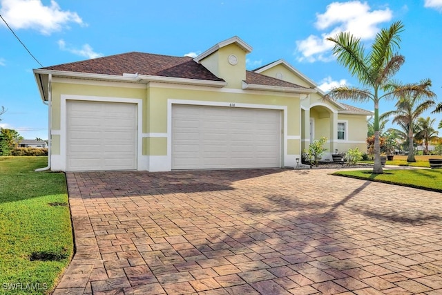 view of front facade with a garage and a front yard