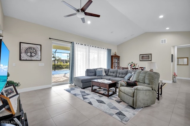 tiled living room featuring ceiling fan and lofted ceiling