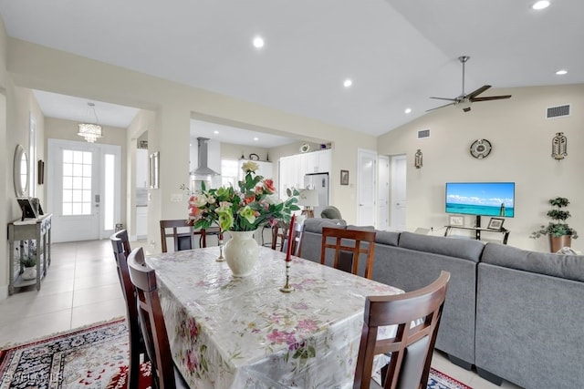 dining area with light tile patterned flooring, lofted ceiling, and ceiling fan