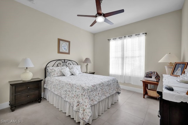 bedroom with light tile patterned floors and ceiling fan