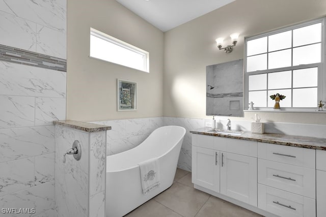 bathroom with vanity, separate shower and tub, and tile walls