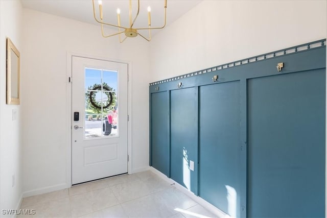 42443 Cascade Dr, Punta Gorda, FL 33982 - foyer entrance featuring baseboards, a notable chandelier, and light tile patterned floors