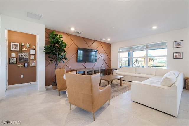 42443 Cascade Dr, Punta Gorda, FL 33982 - living area featuring baseboards, visible vents, an accent wall, and recessed lighting