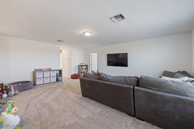 living room featuring visible vents and carpet floors