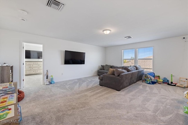 living room with visible vents and carpet