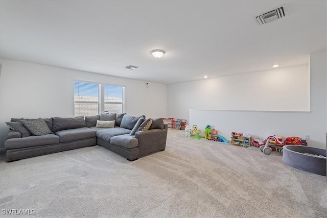 carpeted living room featuring recessed lighting and visible vents