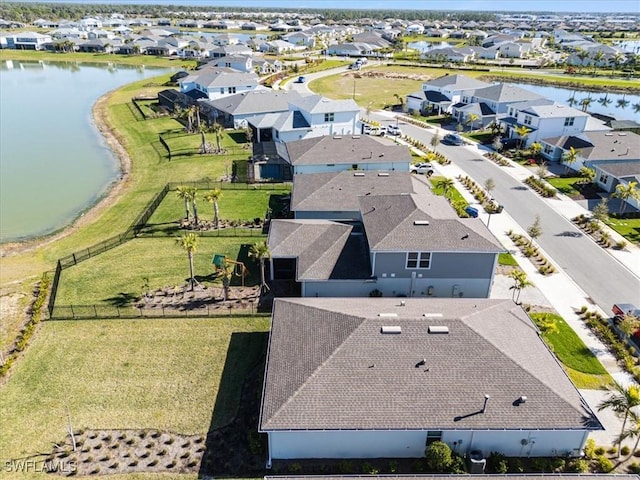 birds eye view of property with a residential view and a water view