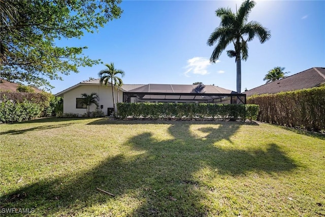 view of yard featuring a lanai