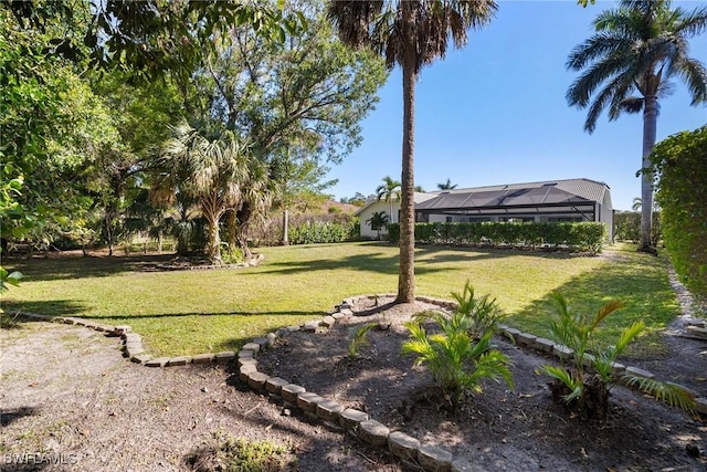 view of yard with a lanai