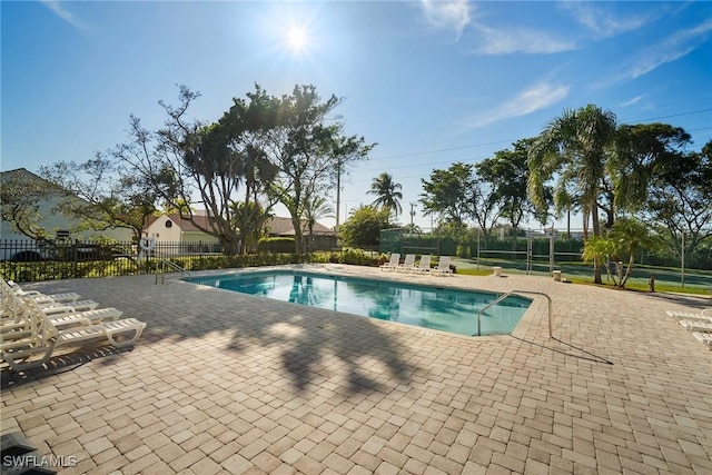 view of swimming pool with a patio area