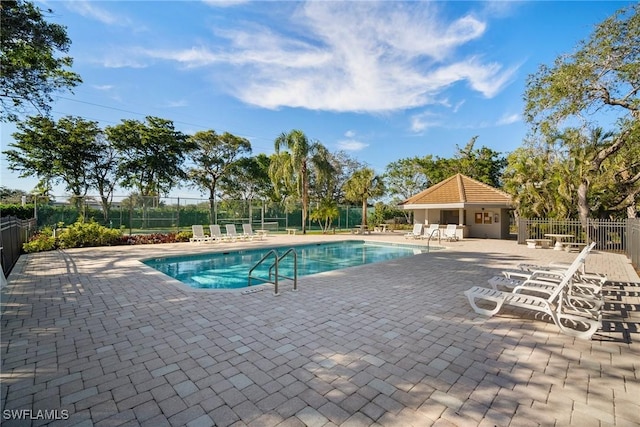 view of swimming pool with a patio area