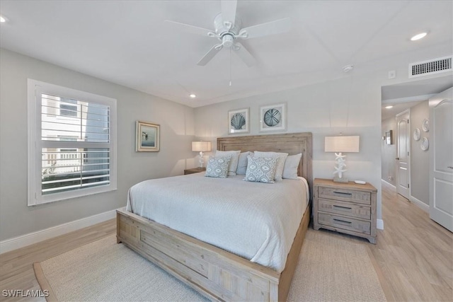 bedroom with light hardwood / wood-style floors and ceiling fan