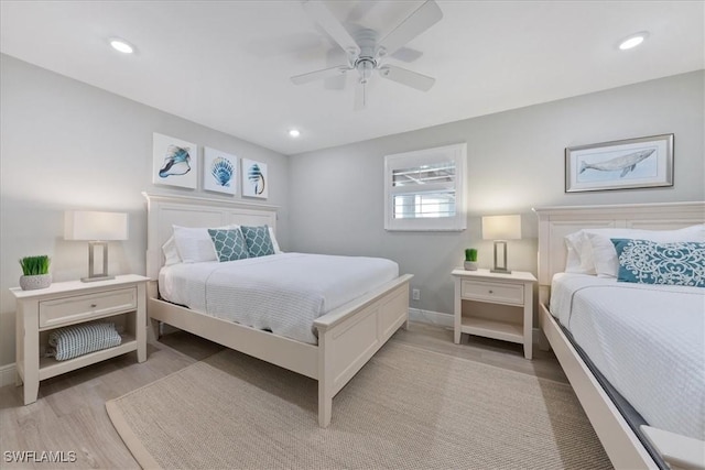 bedroom featuring light hardwood / wood-style flooring and ceiling fan