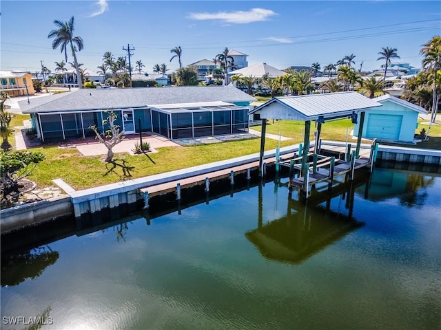 dock area featuring a lawn and a water view