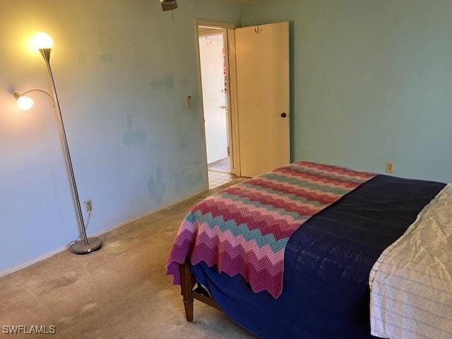 bedroom featuring light colored carpet