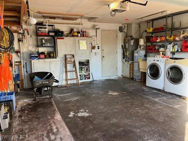 garage with a garage door opener, electric water heater, and washing machine and clothes dryer