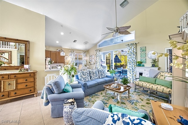 living room featuring light tile patterned floors, high vaulted ceiling, and ceiling fan