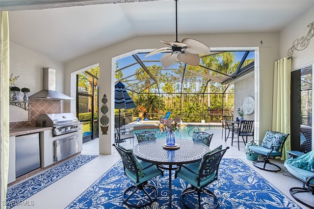 view of patio / terrace featuring ceiling fan, an outdoor kitchen, grilling area, and glass enclosure