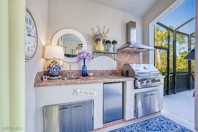 view of patio / terrace with sink, grilling area, glass enclosure, and exterior kitchen