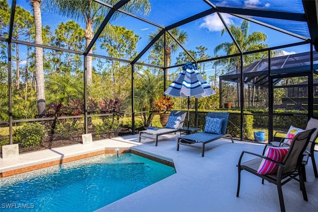 view of pool featuring a patio, a lanai, and pool water feature