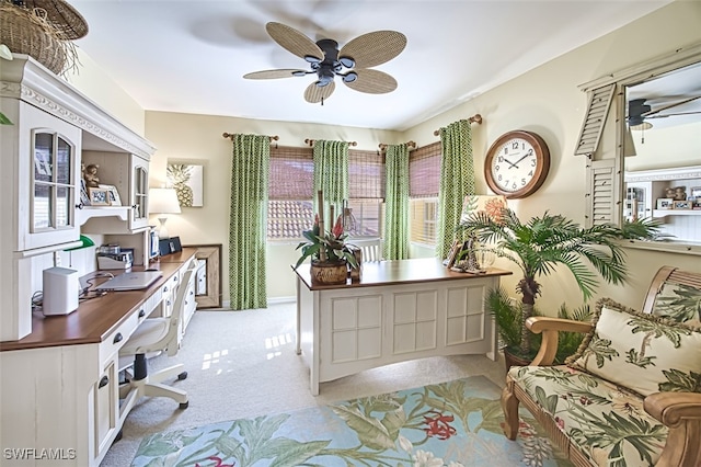 office with ceiling fan and light carpet