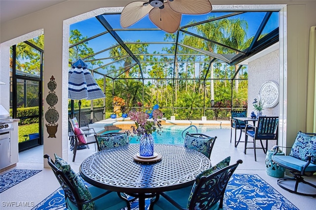 view of patio / terrace with a lanai and ceiling fan