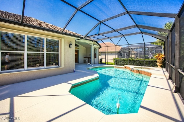 9062 Shadow Glen Way, Fort Myers, FL 33913 - view of pool with a patio area, a pool with connected hot tub, and glass enclosure