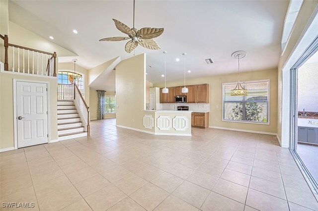 9062 Shadow Glen Way, Fort Myers, FL 33913 - unfurnished living room with light tile patterned floors, stairs, baseboards, ceiling fan, and high vaulted ceiling