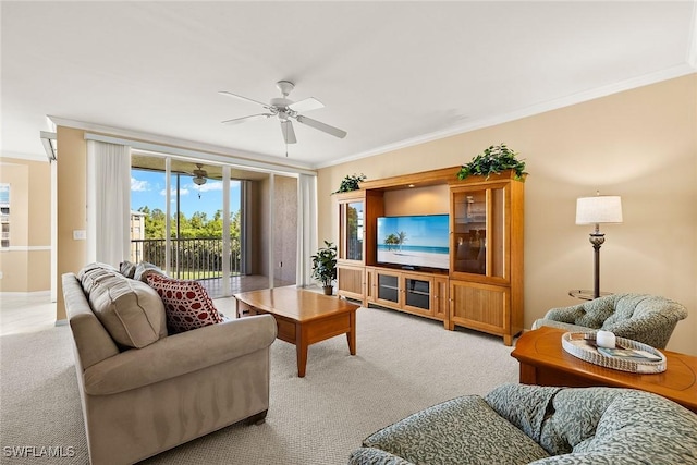 carpeted living room with crown molding and ceiling fan