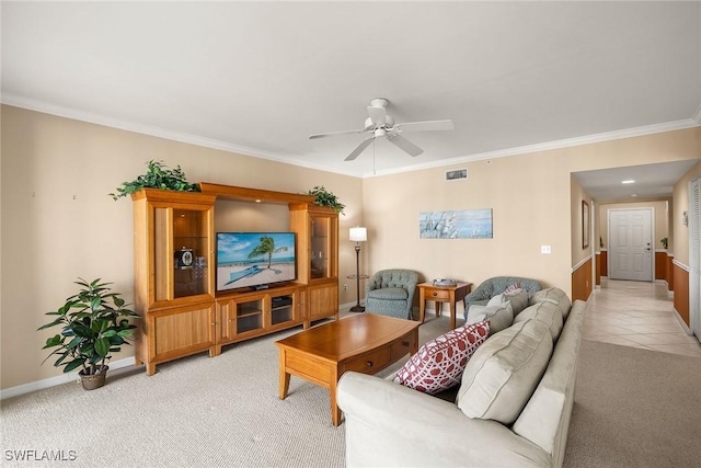 carpeted living room featuring ceiling fan and ornamental molding