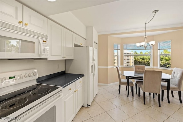 kitchen with white cabinetry, white appliances, decorative light fixtures, and a notable chandelier