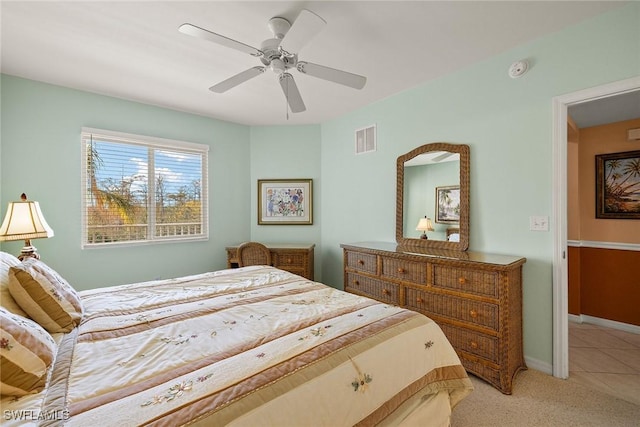 bedroom featuring light colored carpet and ceiling fan