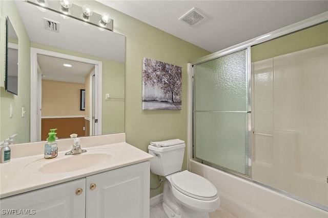 full bathroom with vanity, shower / bath combination with glass door, and toilet