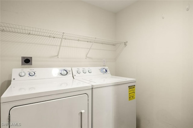 washroom with separate washer and dryer