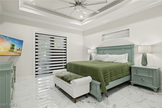 bedroom featuring crown molding, ceiling fan, and a tray ceiling