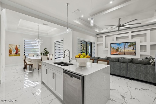 kitchen with pendant lighting, sink, white cabinets, stainless steel dishwasher, and a raised ceiling